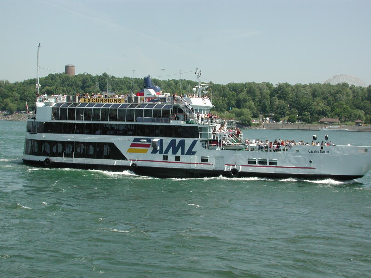 Tour boat passing Clock Tower at Harbour Basin, Montreal