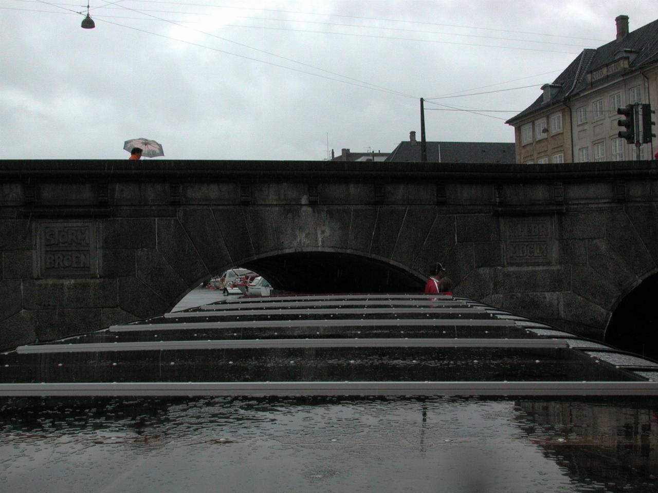 KPLU Viking Jazz: Tour boat negotiating a low, narrow bridge with a sharp turn at the end