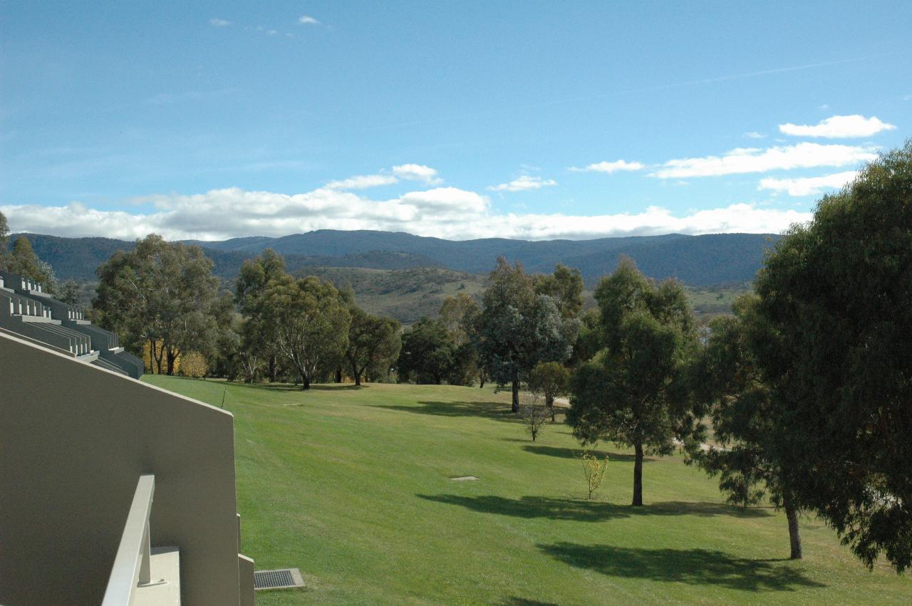 Green lawns, and vista to distant mountains