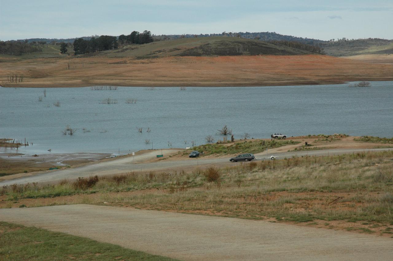Old town site, parked cars, distant lake water