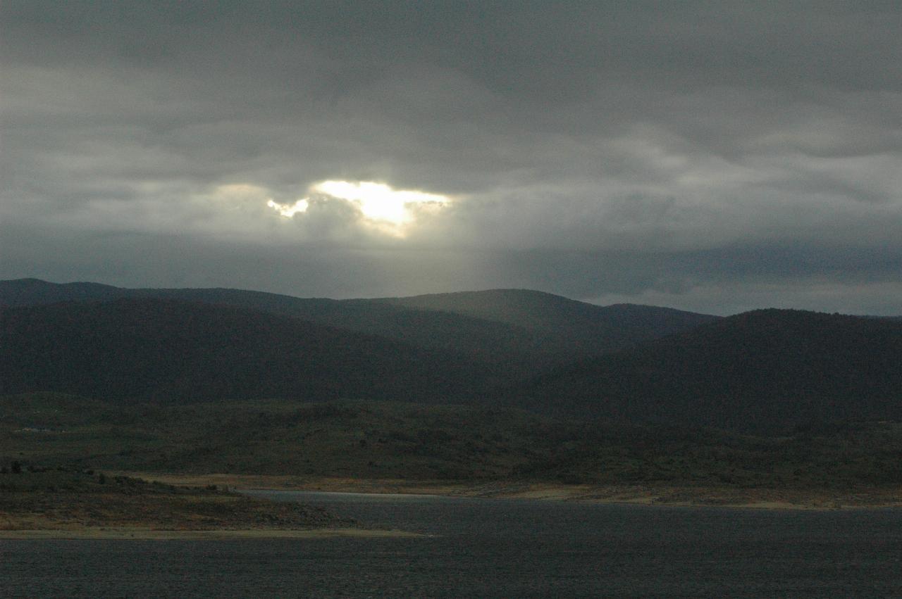 Afternoon sun peeking through clouds