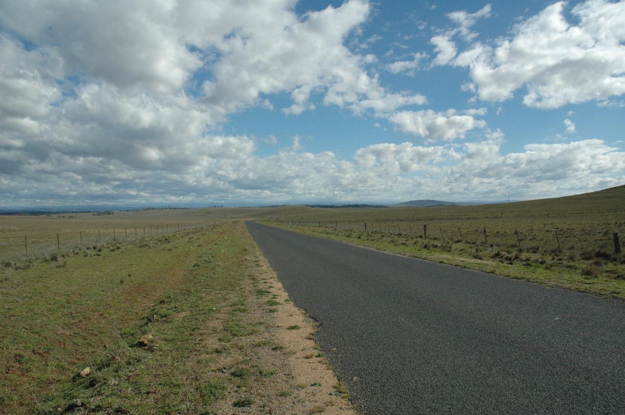 Flat country to barely visible distant mountains
